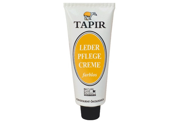 Lederpflegecreme in Tube mit Schraubverschluss und Etikett, schräge Vorderansicht