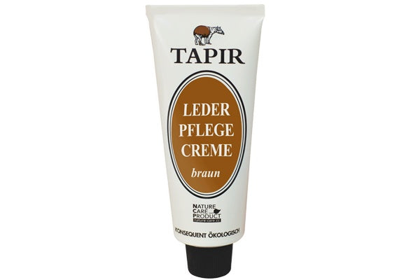 Lederpflegecreme in Tube mit Schraubverschluss und Etikett, schräge Vorderansicht
