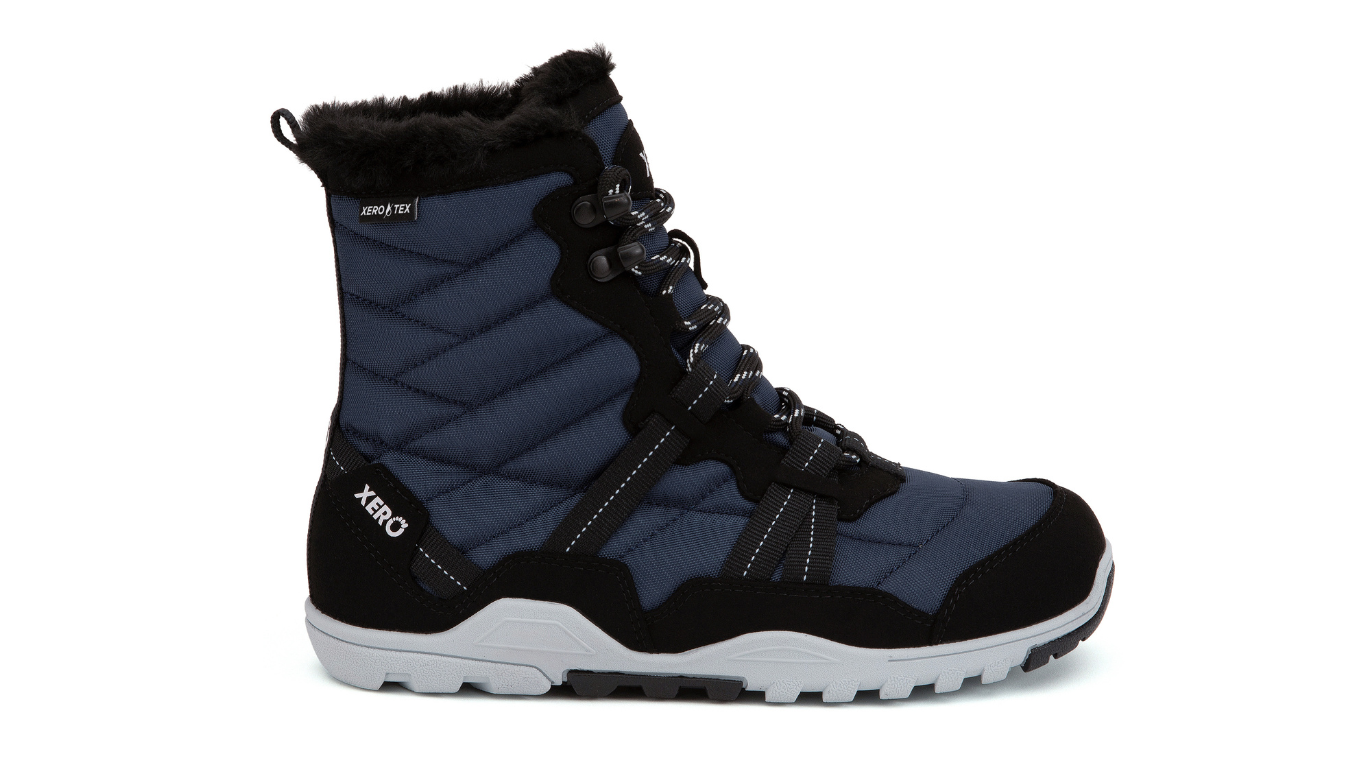 Barfußwinterstiefel, geschlossene Zehen und geschlossener Fersenbereich, Schnürung mit Ösen, profilierte Sohle, Einzelschuh, Seitenansicht außen