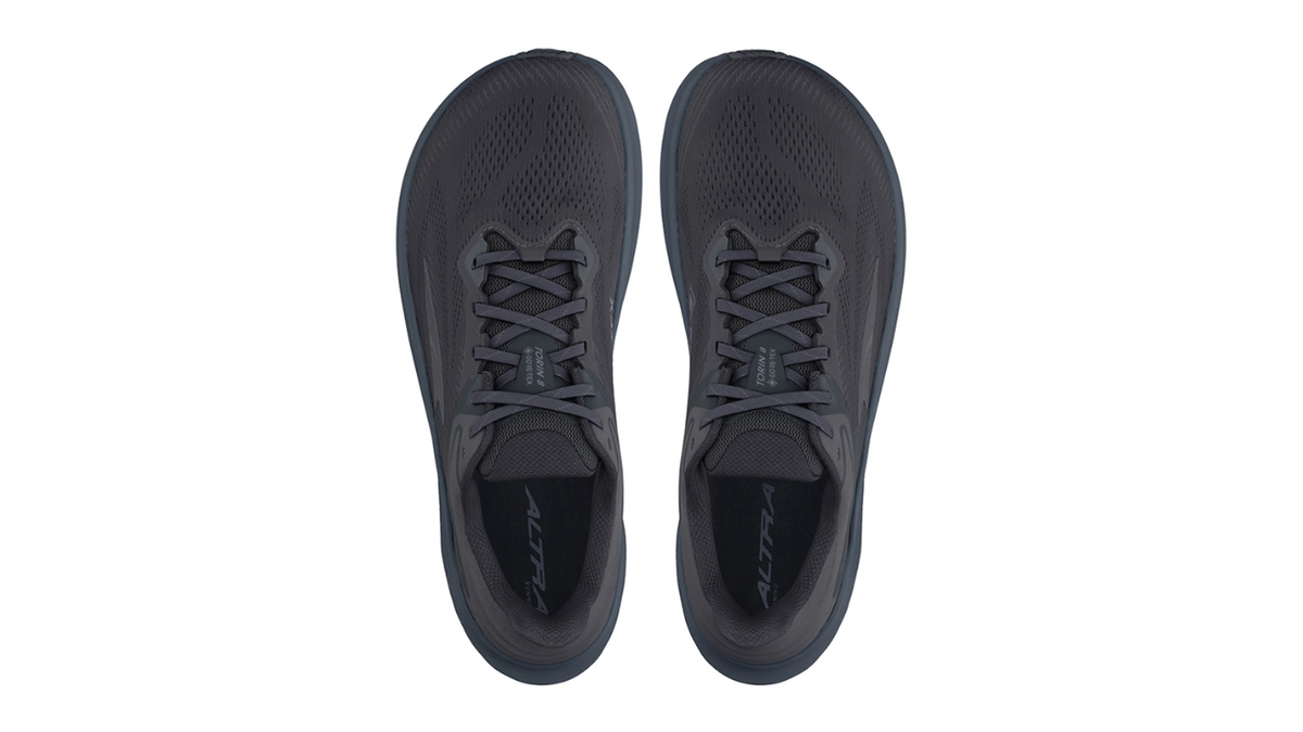 Laufschuhe als Paar, Draufsicht von oben. Innenform und Fersenaufnahme sichtbar.