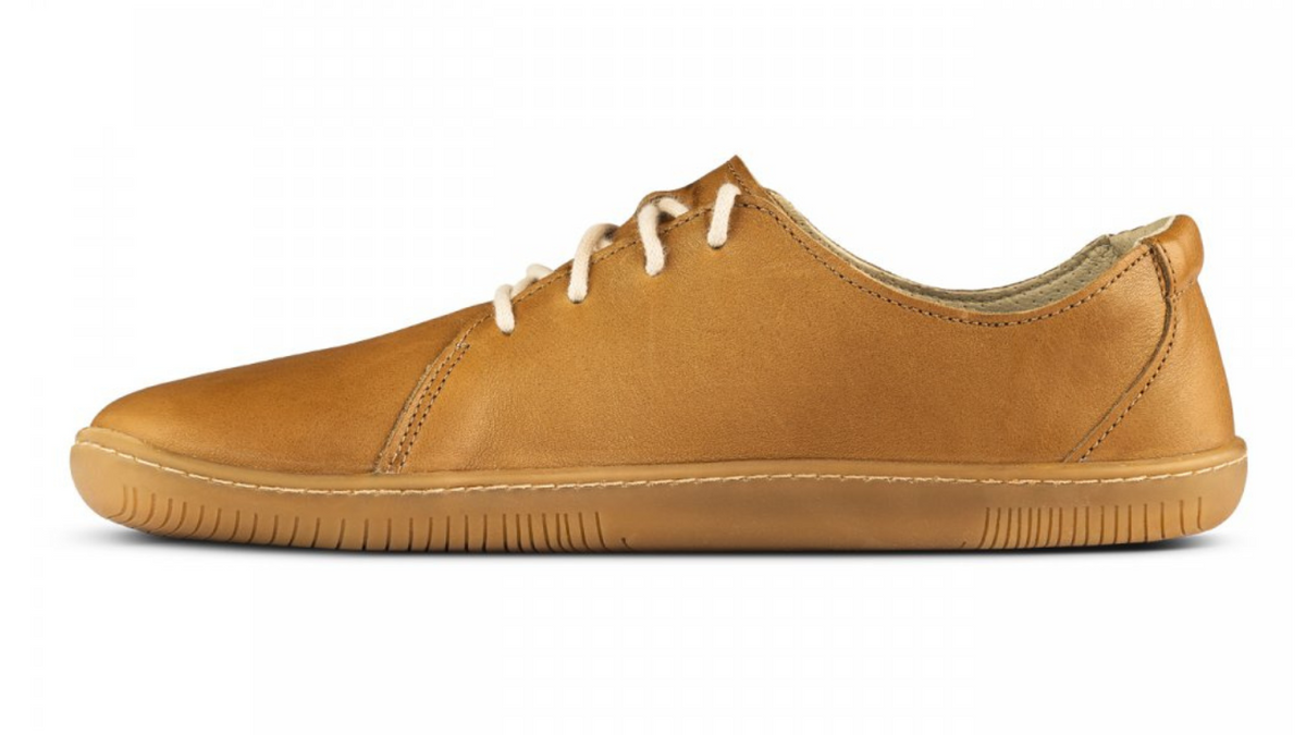 Barfußschuh, Seitenansicht innen. Geschlossener Schuh mit Schnürung, flache Sohle, gleichmäßige Sohlenstärke.