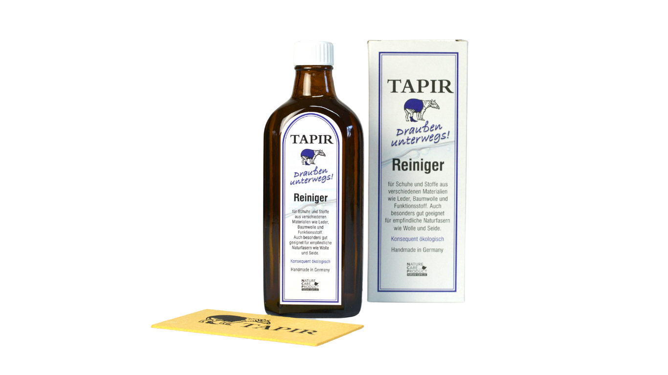 Lederreiniger in Glasflasche mit Schraubverschluss, Verpackungskarton und Schwamm, schräge Vorderansicht
