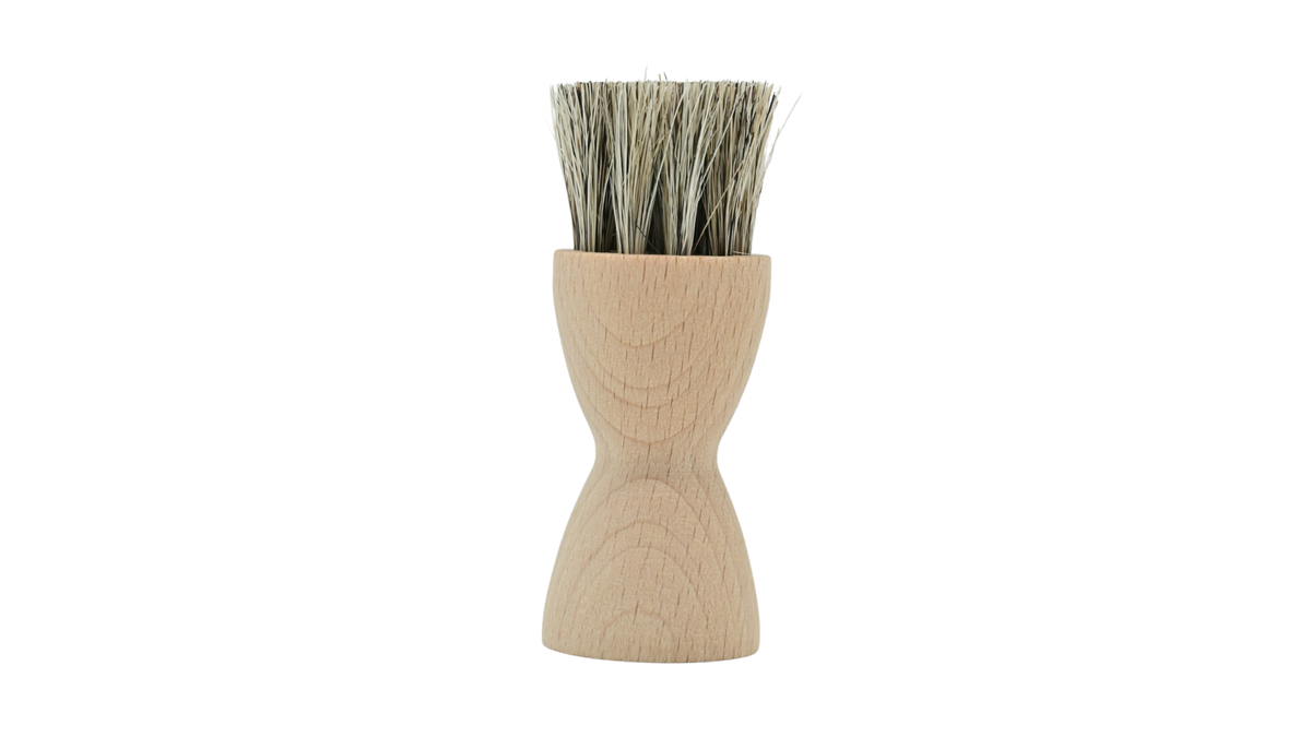 Auftragbürste mit rundem Holzgriff und Borstenkopf, Draufsicht