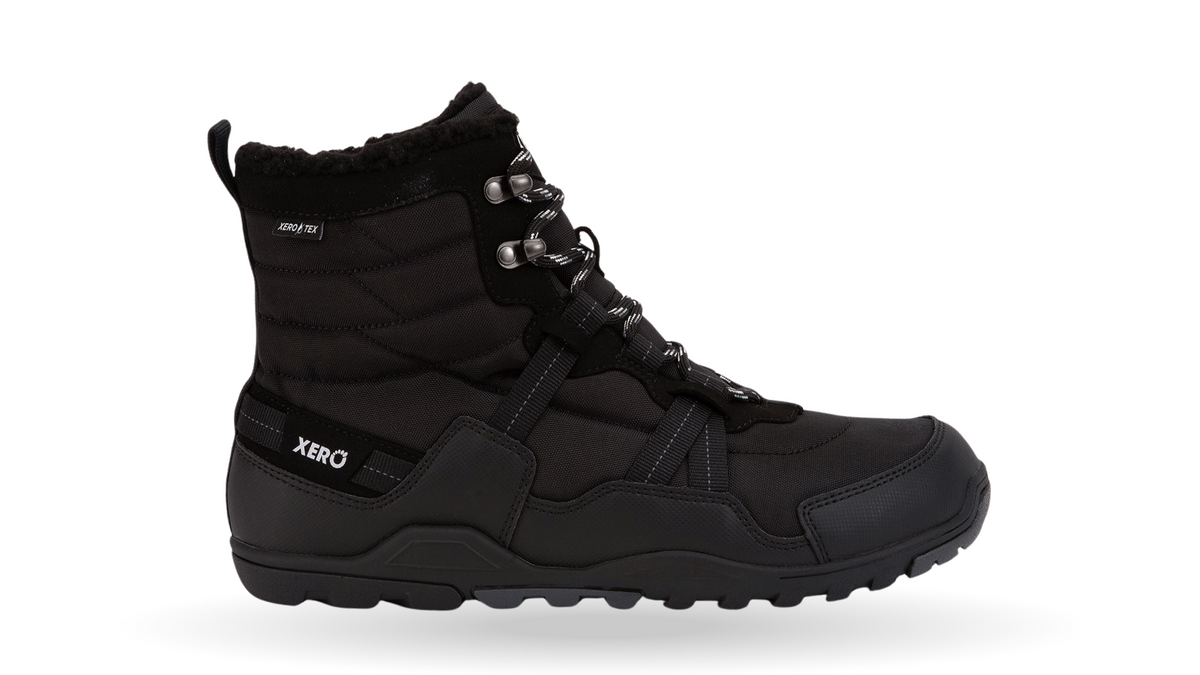 Barfußwinterstiefel, geschlossene Zehen und geschlossener Fersenbereich, Schnürung mit Ösen, profilierte Sohle, einzelner Schuh, Seitenansicht außen