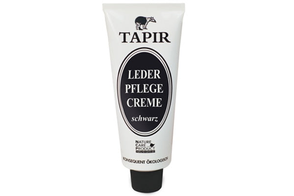 Lederpflegecreme in Tube mit Schraubverschluss und Etikett, schräge Vorderansicht