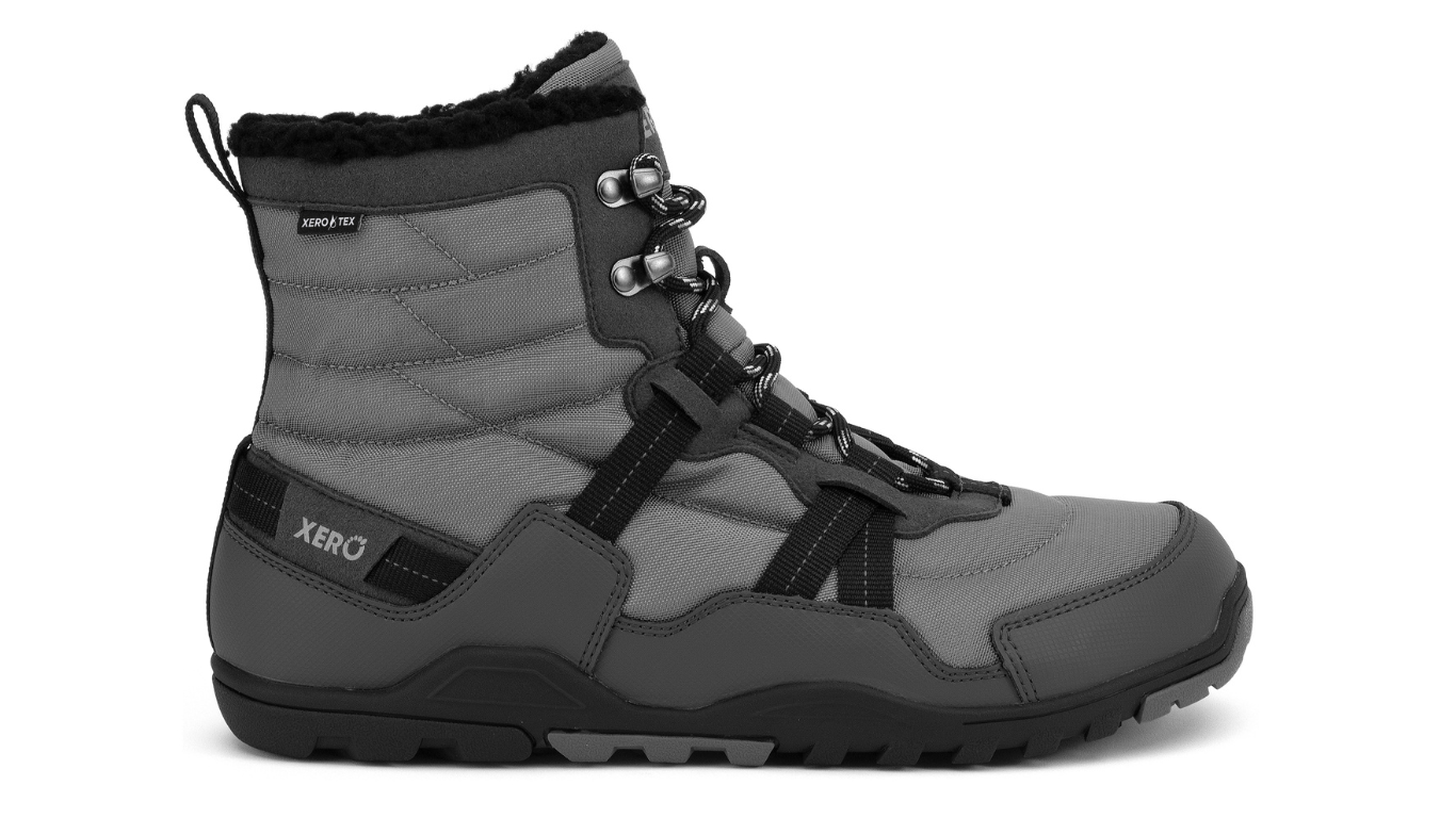 Barfußwinterstiefel, geschlossene Zehen und geschlossener Fersenbereich, Schnürung mit Ösen, profilierte Sohle, Einzelschuh, Seitenansicht außen