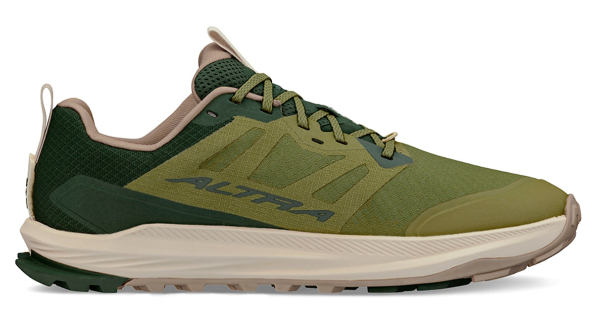 Trailrunningschuh, flache geschlossene Ausführung, Seitenansicht rechts Innenseite. Schnürung, niedrig geschnittener Schaft, stark profilierte Sohle.