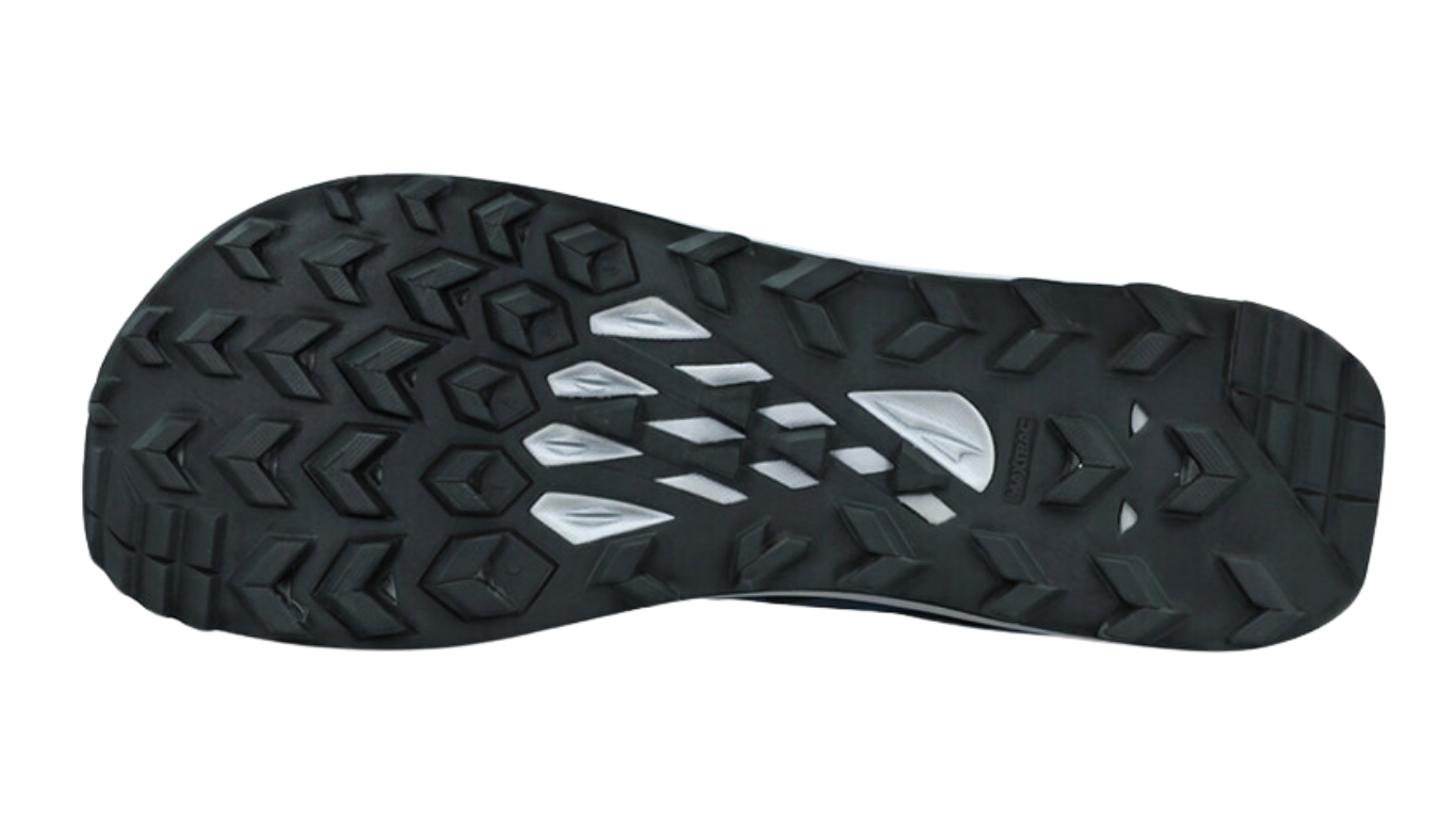 Trailrunningschuh, Ansicht von unten. Grob profilierte Laufsohle mit offenem Stollenmuster.