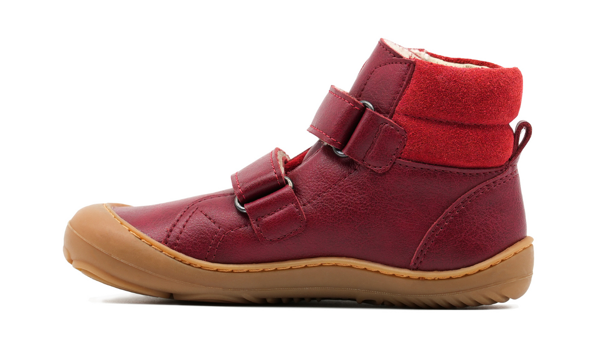 Barfußschuh für Kinder, knöchelhoch, Seitenansicht innen. Geschlossener Schuh mit Klettverschluss, flache flexible Sohle, breite Zehenbox.