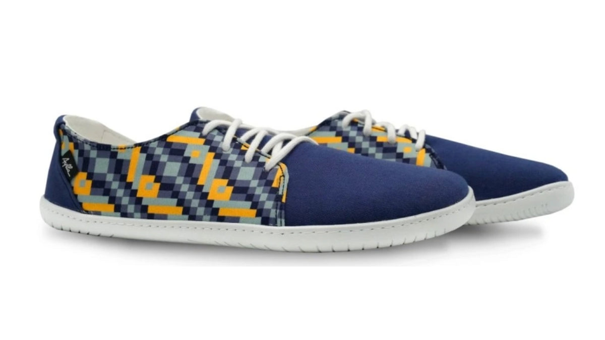 Barfußschuhe als Paar, schräge Seitenansicht nach rechts.
Niedriger Aufbau, gleichmäßige Leistenbreite, flexible Sohle erkennbar.