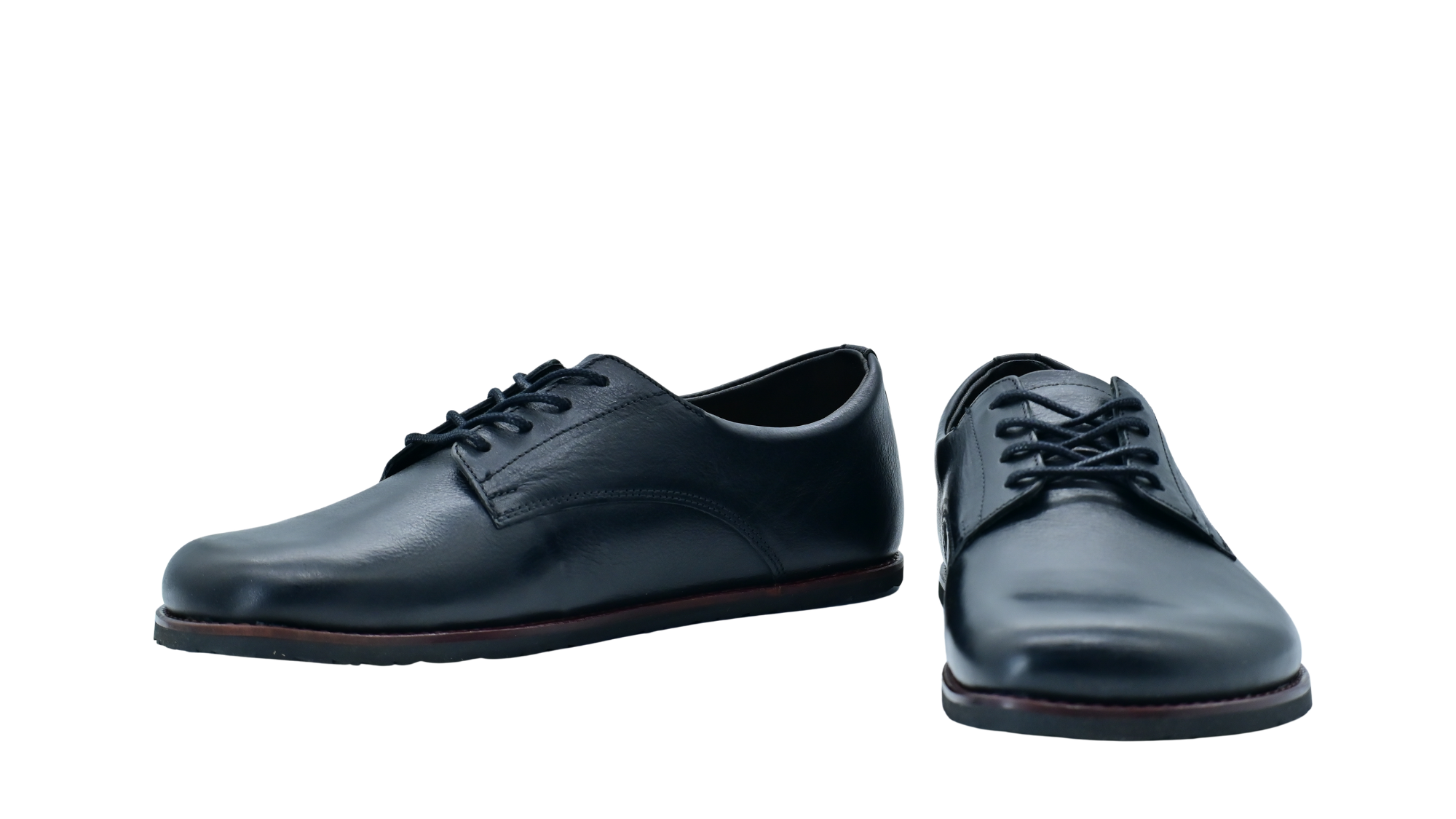 Barfußschuh mit Schnürung, geschlossener Zehenpartie und flexibler Sohle, Seiten- und Vorderansicht als Paar