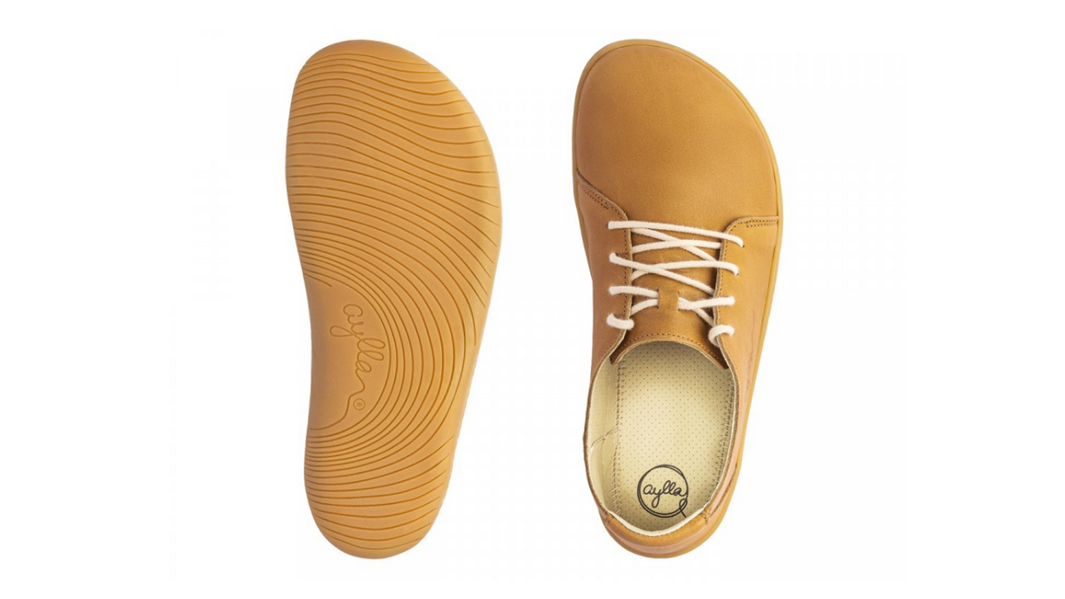 Barfußschuh, Ansicht von unten. Flache flexible Sohle mit durchgehendem Profil, keine Absatzform erkennbar.