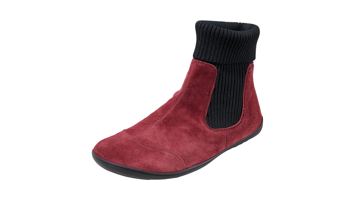 Barfußstiefelette für Erwachsene mit breiter Zehenbox, flexible Sohle, geschlossene Zehen und geschlossene Ferse, schräge Vorderansicht als Paar.