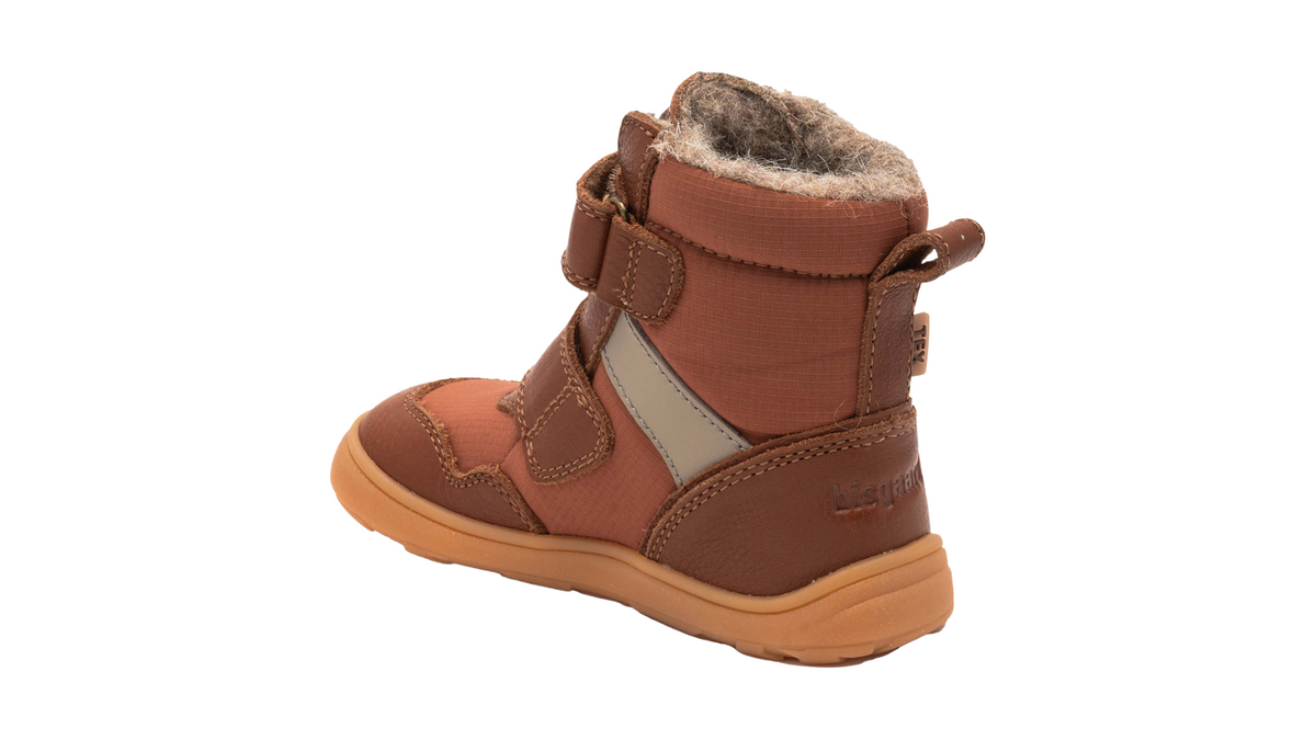Barfußwinterstiefel für Kinder mit Klettverschluss, geschlossenen Zehen und geschlossener Ferse, Seitenansicht innen.