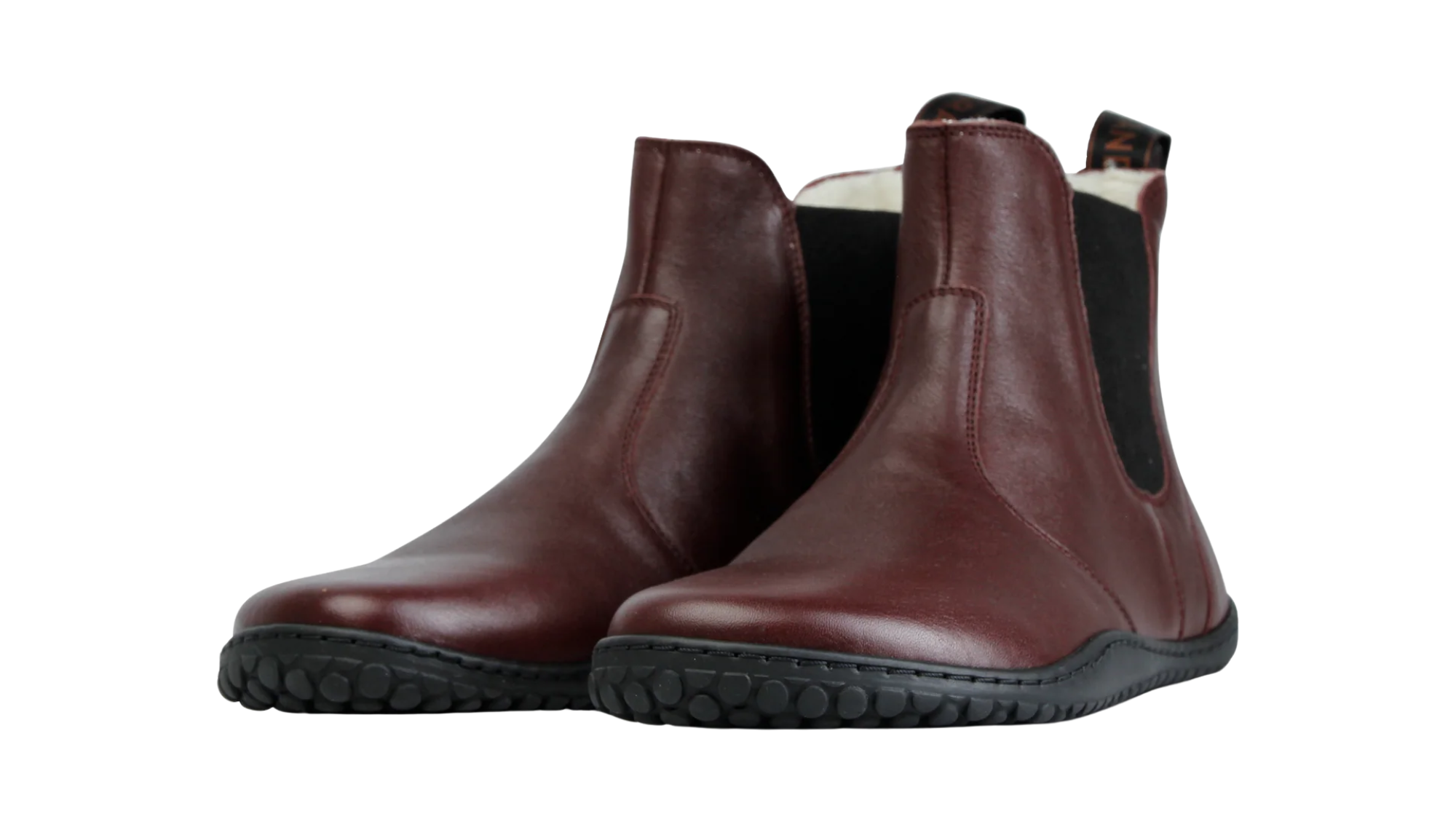 Paar Winter-Chelsea-Barfußschuhe für Erwachsene mit breiter Zehenbox und elastischen Seiteneinsätzen, schräge Vorderansicht