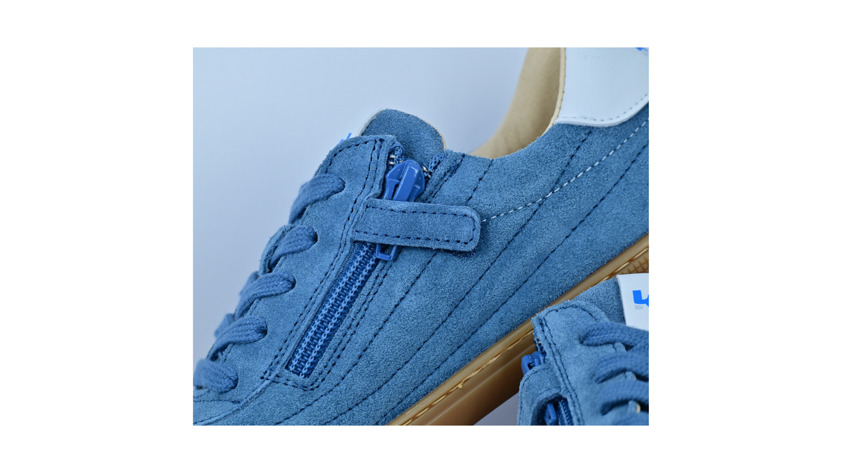 Barfußschuh für Erwachsene, geschlossene Zehenpartie, geschlossener Fersenbereich, Schnürung, Ziernähte im Seitenbereich, flache Sohle, Detailansicht Reißverschluss