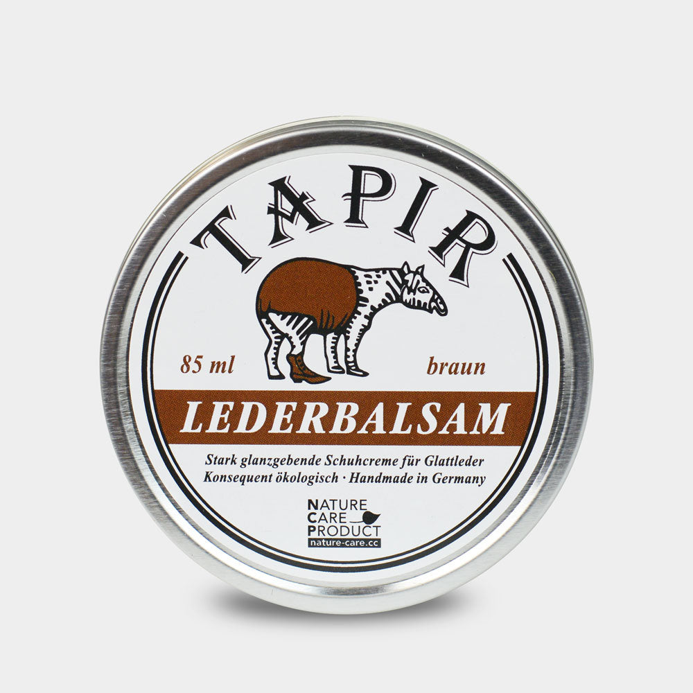 Lederbalsam in runder Metalldose mit Schraubdeckel und Etikett, Draufsicht