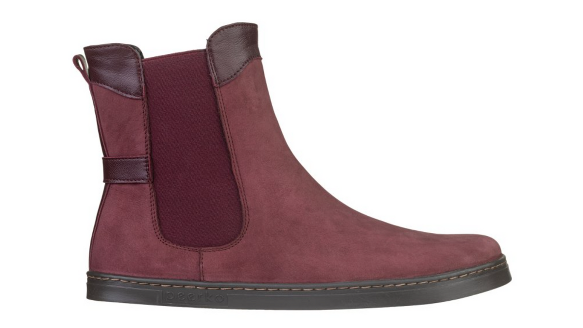 Barfußstiefel mit elastischem Einsatz seitlich, breiter Zehenbox und flacher Sohle, geschlossener Fersenbereich, Seitenansicht außen