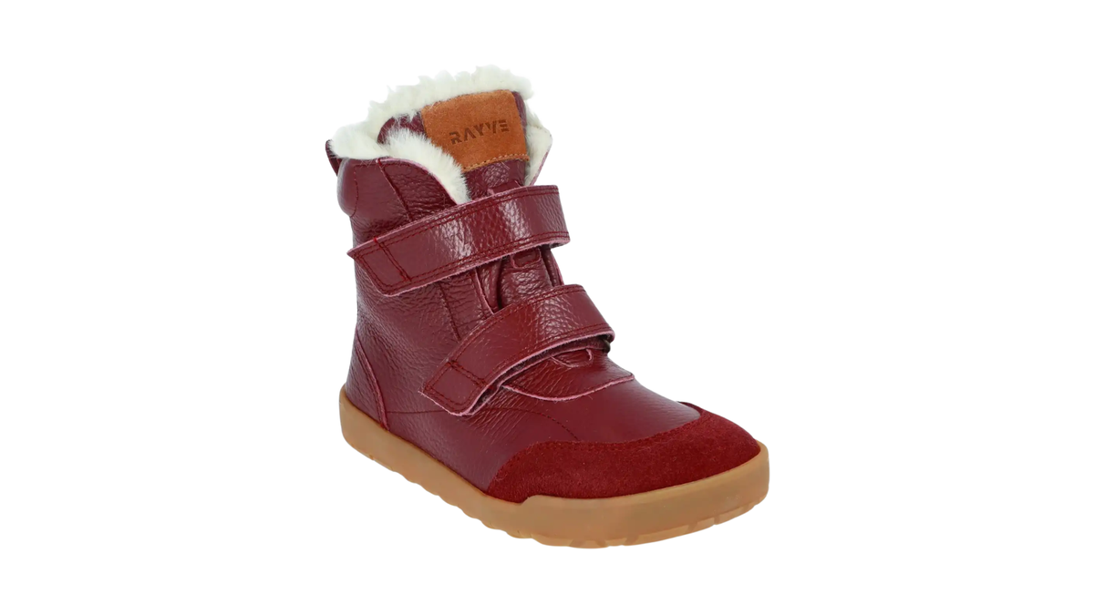 Kinder-Barfußwinterstiefel mit zwei Klettverschlüssen, hohem Schaft und sichtbarem Futter, schräge Vorderansicht