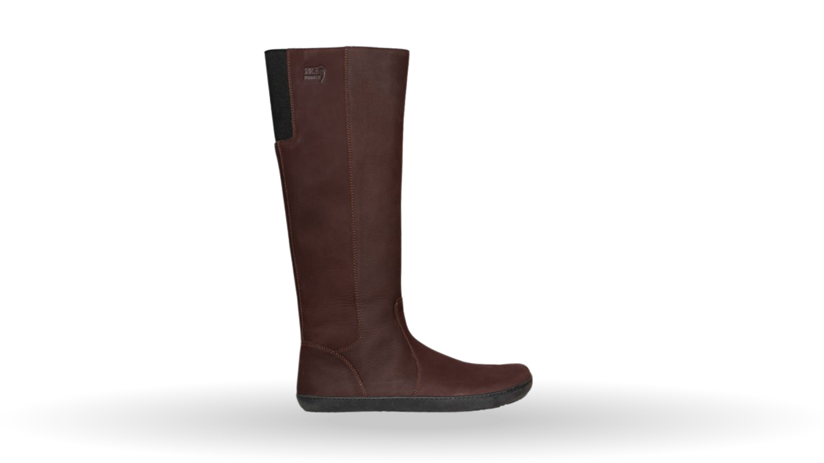 Kniehoher Barfußstiefel für Erwachsene mit breiter Zehenbox, hohem Schaft und flacher Sohle, Seitenansicht außen