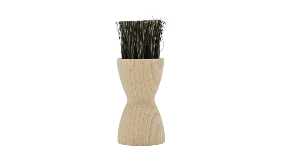 Auftragbürste mit rundem Holzgriff und Borstenkopf, Draufsicht