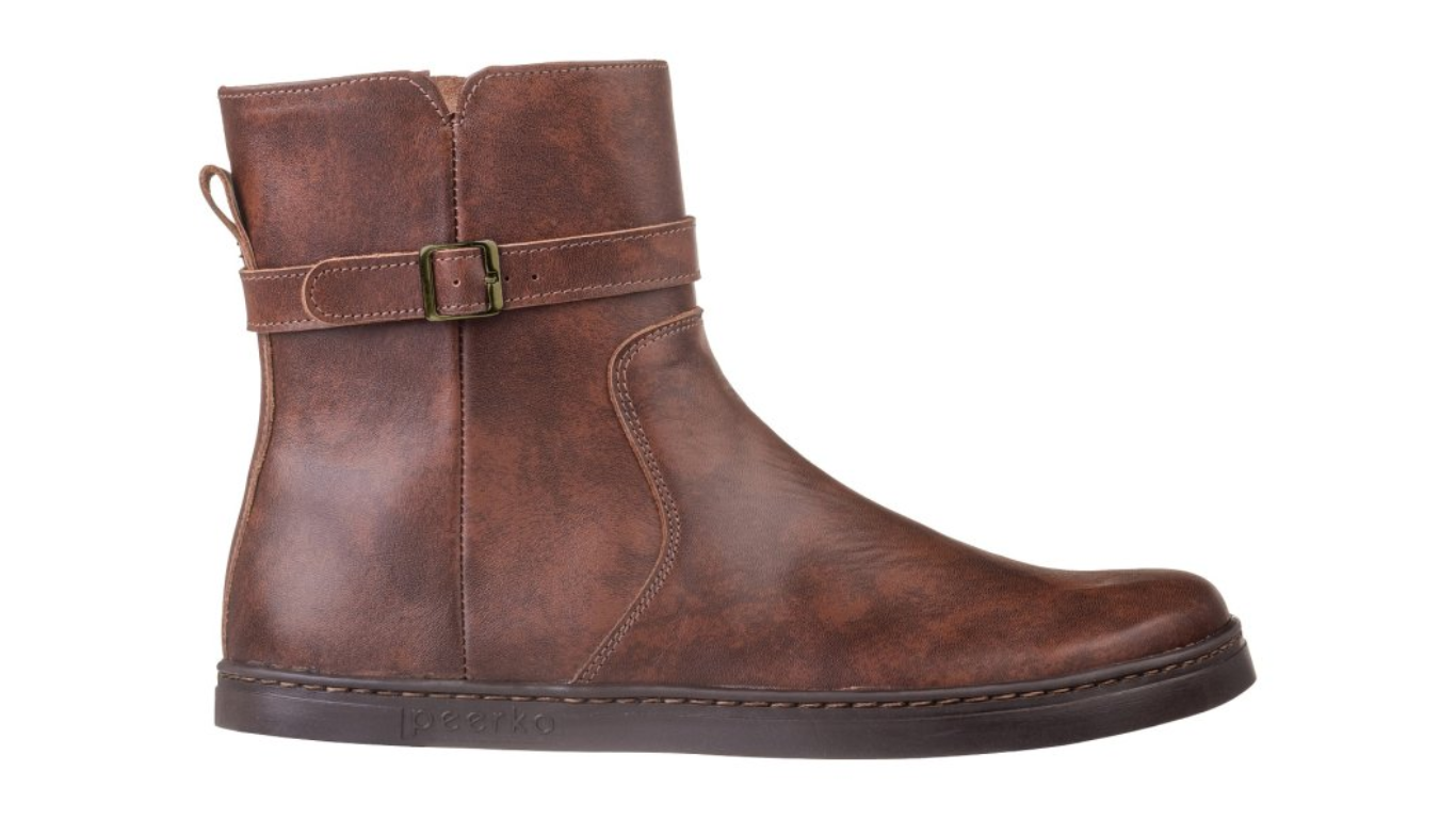 Barfußstiefel mit seitlichem Reißverschluss und Riemen am Schaft, breiter Zehenbox und flacher Sohle, geschlossener Fersenbereich, Seitenansicht außen