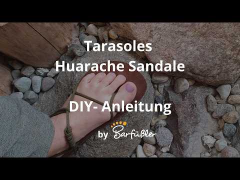 Barfußsandale am Fuß in Draufsicht, mit offenen Zehen und dünnen Riemen; Vorschaubild einer Anleitung.